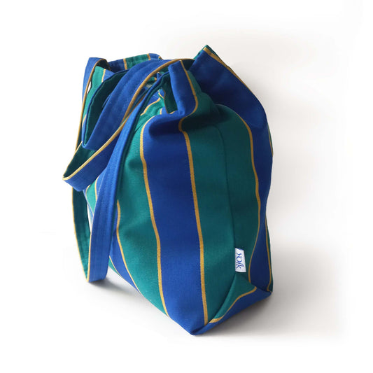 A blue and green stripes fabric summer bag