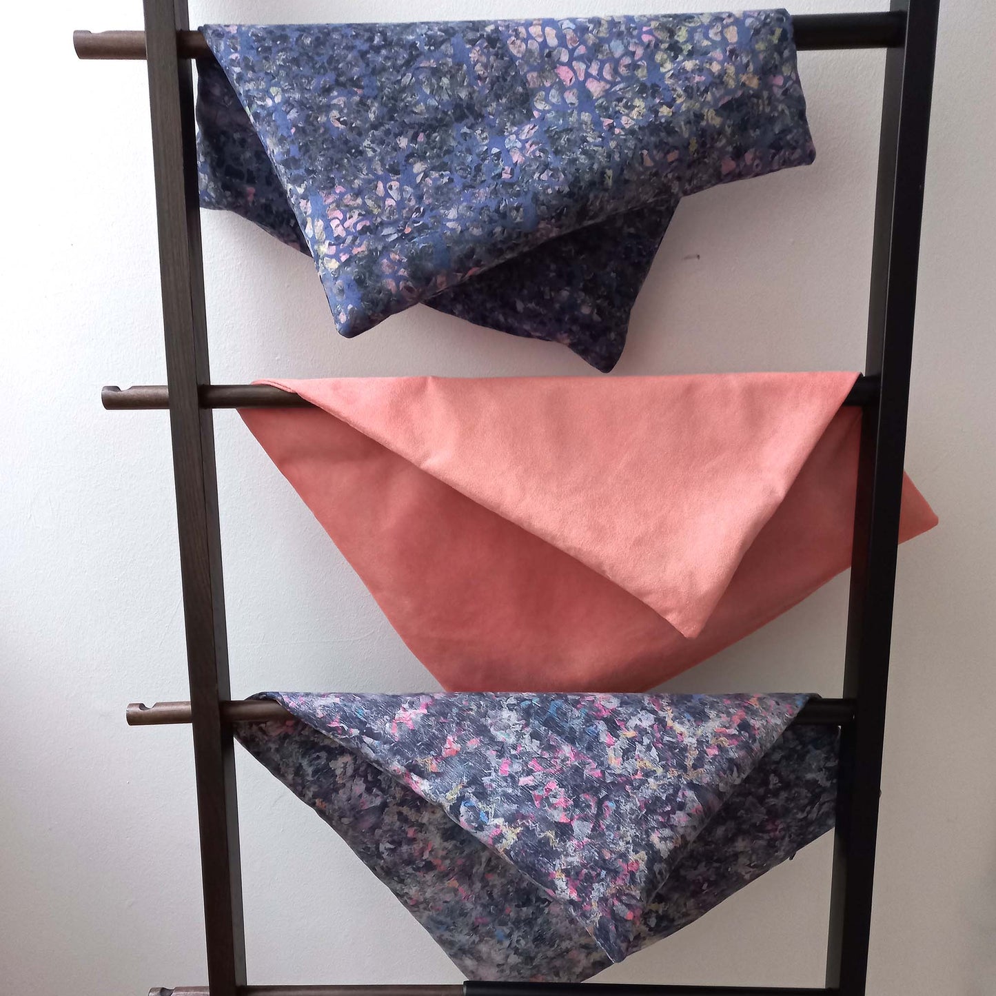Cushion covers on a ladder hanger