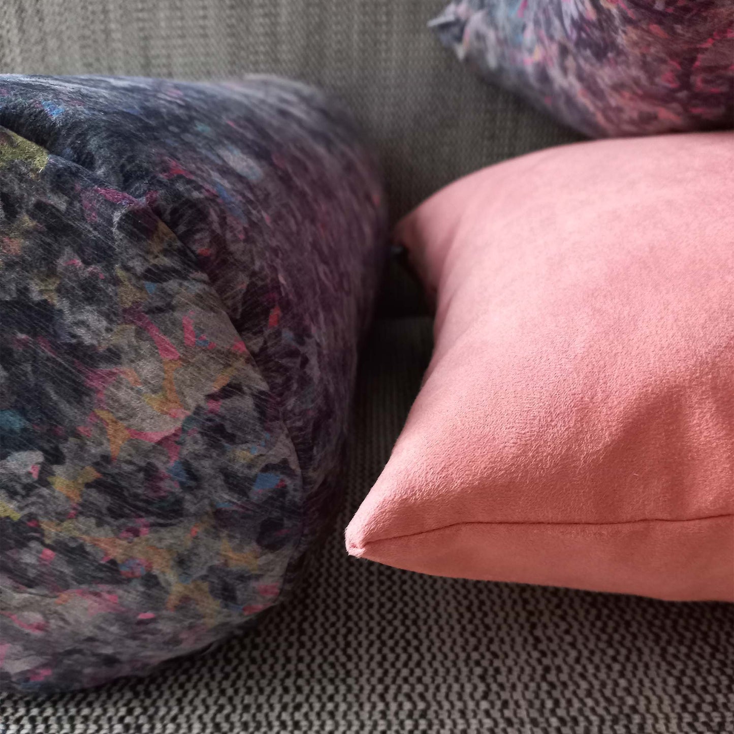 Pink colour cushion close-up on sofa