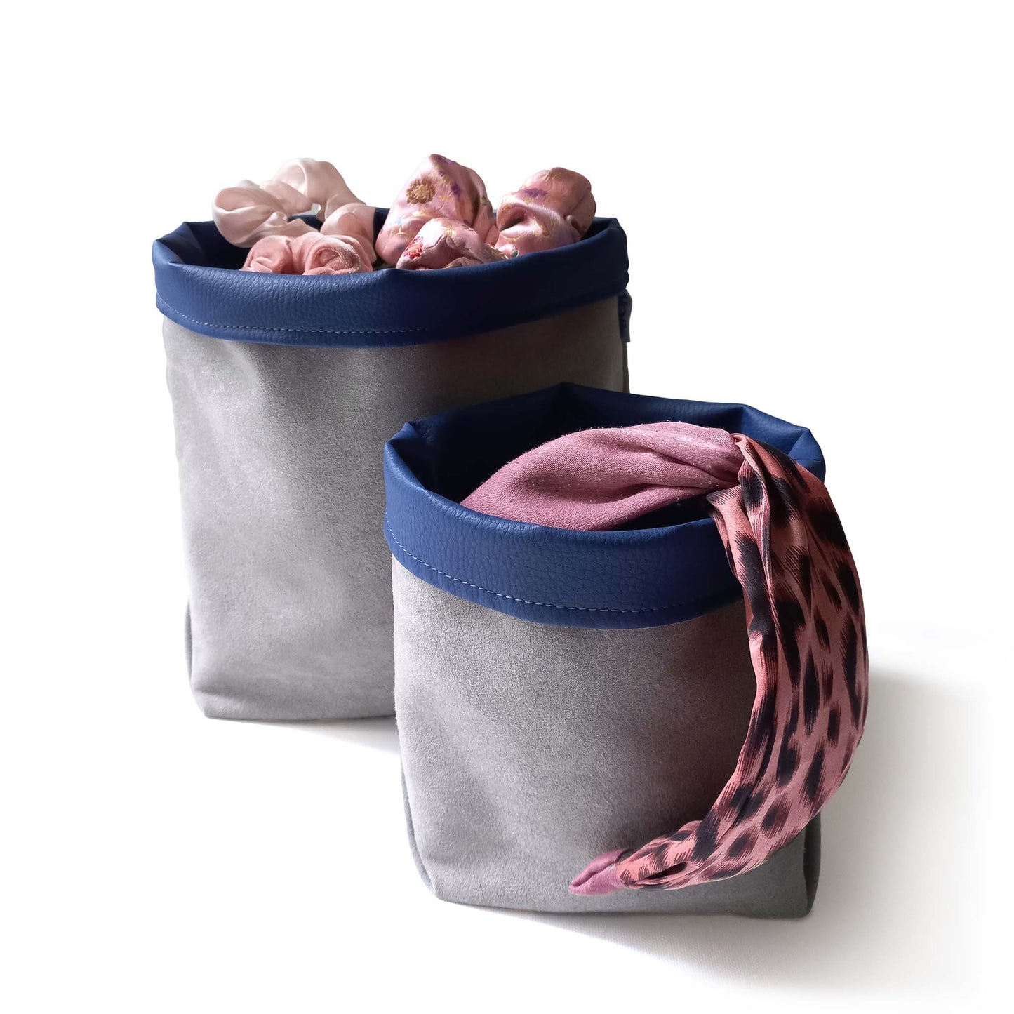 Two storage baskets filled with hair accessories