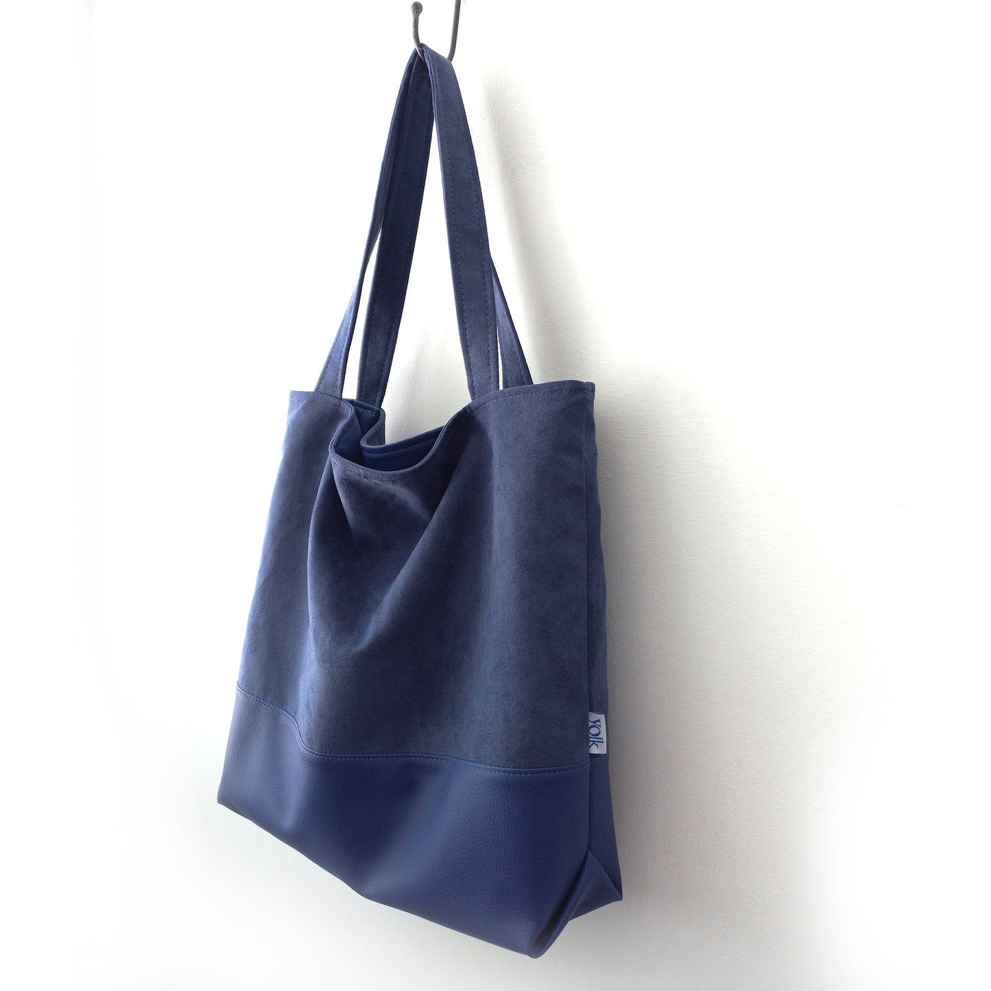 Blue shoulder bag on a hanger
