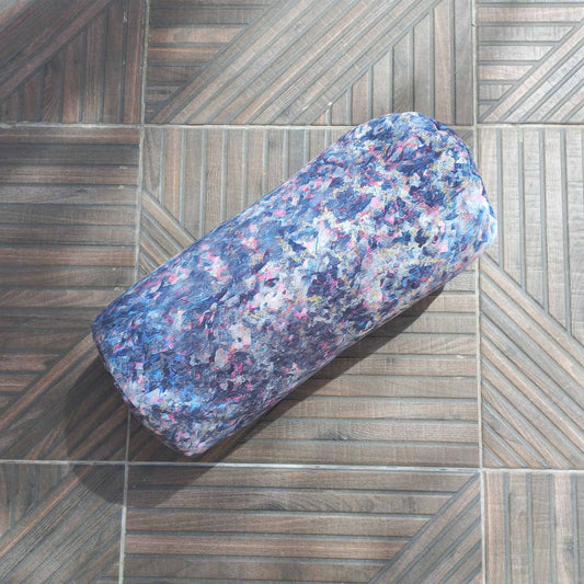 Printed bolster cushion on a patio floor