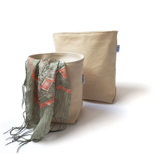 Two sand colour baskets with a scarf