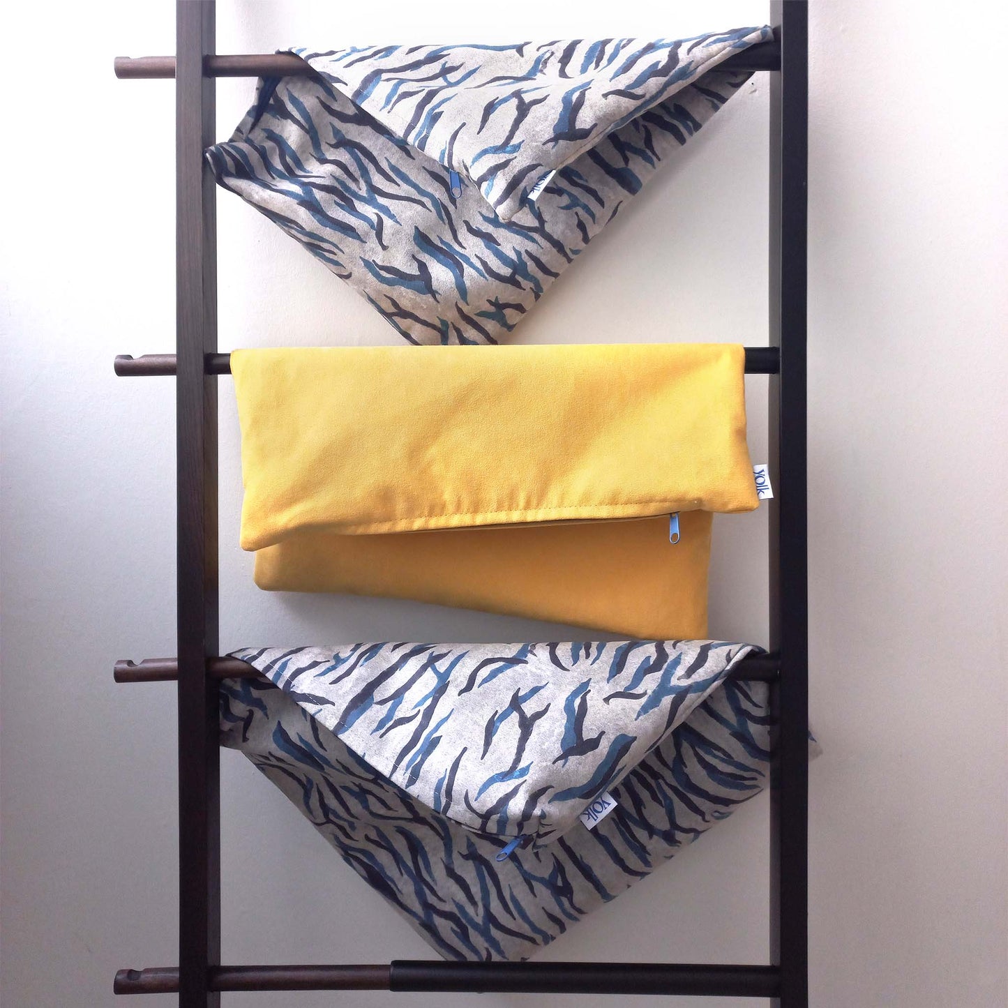 Decorative cushion covers on a hanger