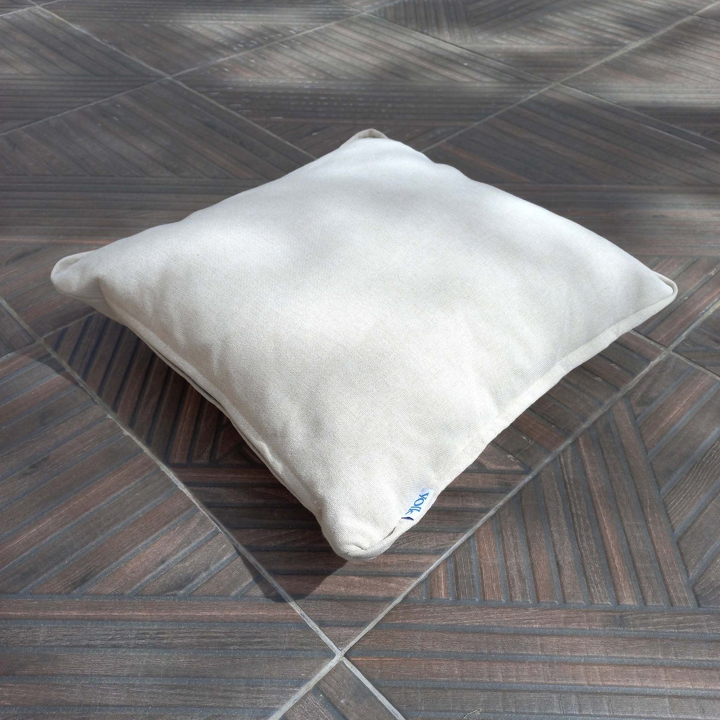 Decorative cushion on a patio floor