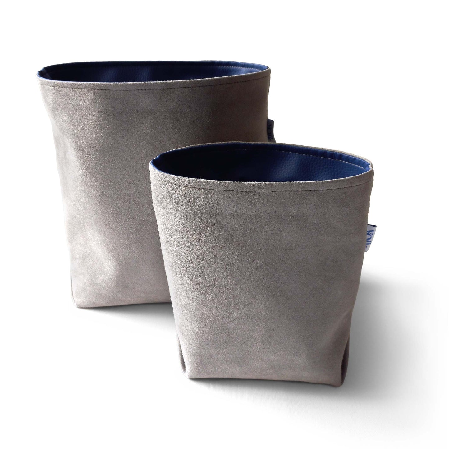 Set of two storage baskets in gravel green colour, front view