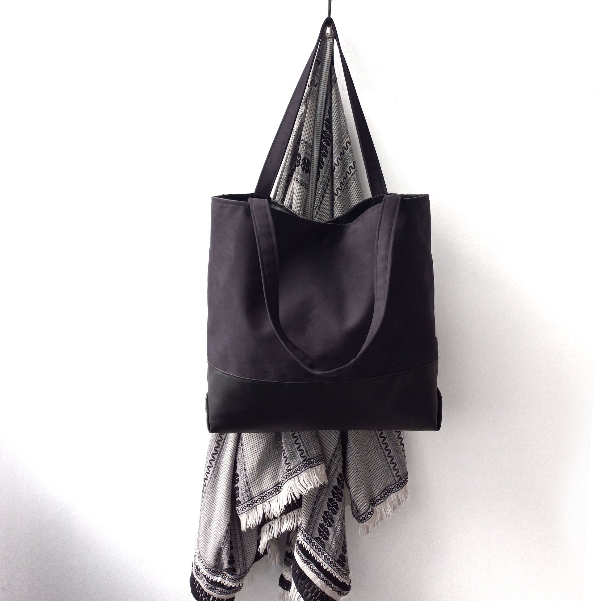 Black shoulder bag on a hanger