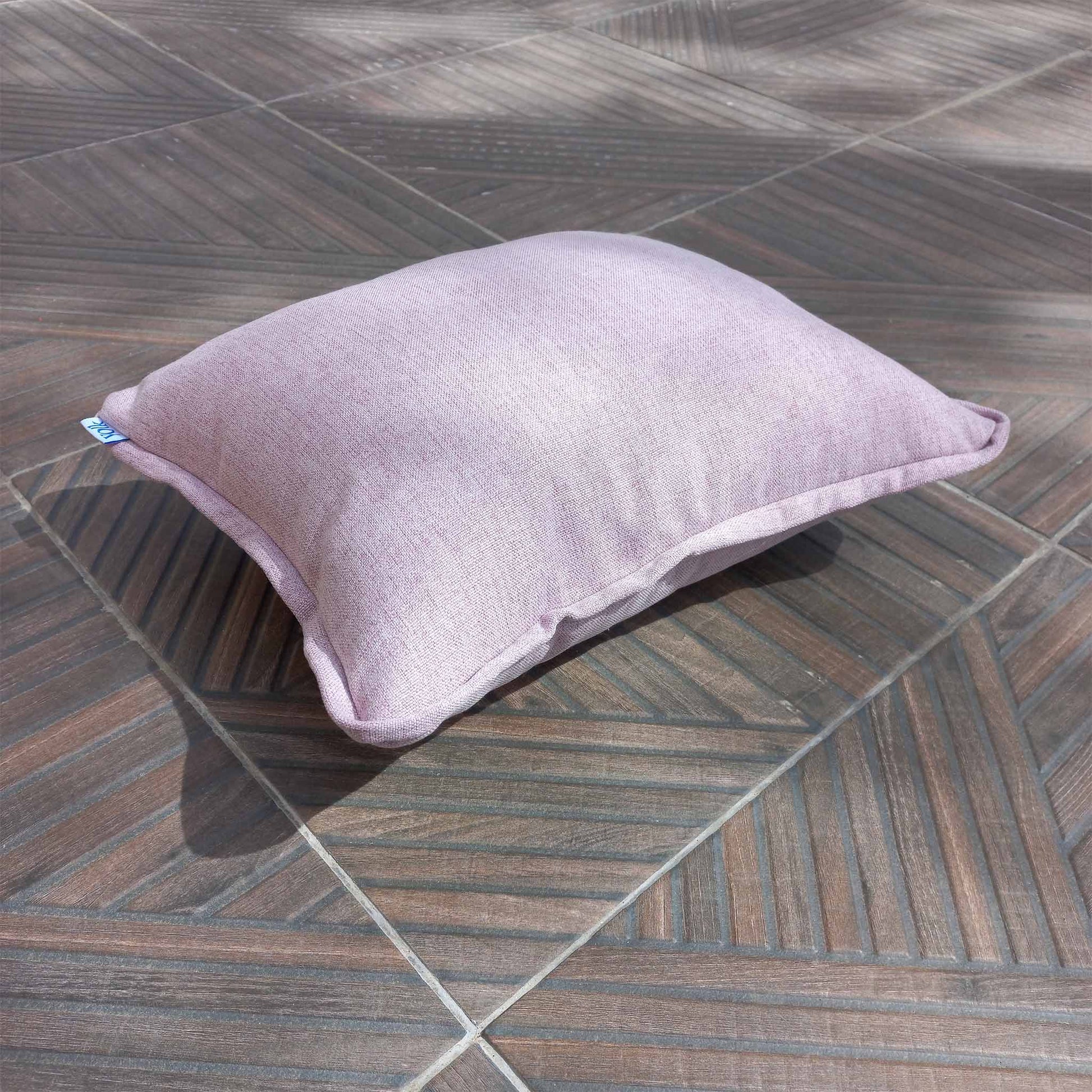 Decorative cushion on a patio floor