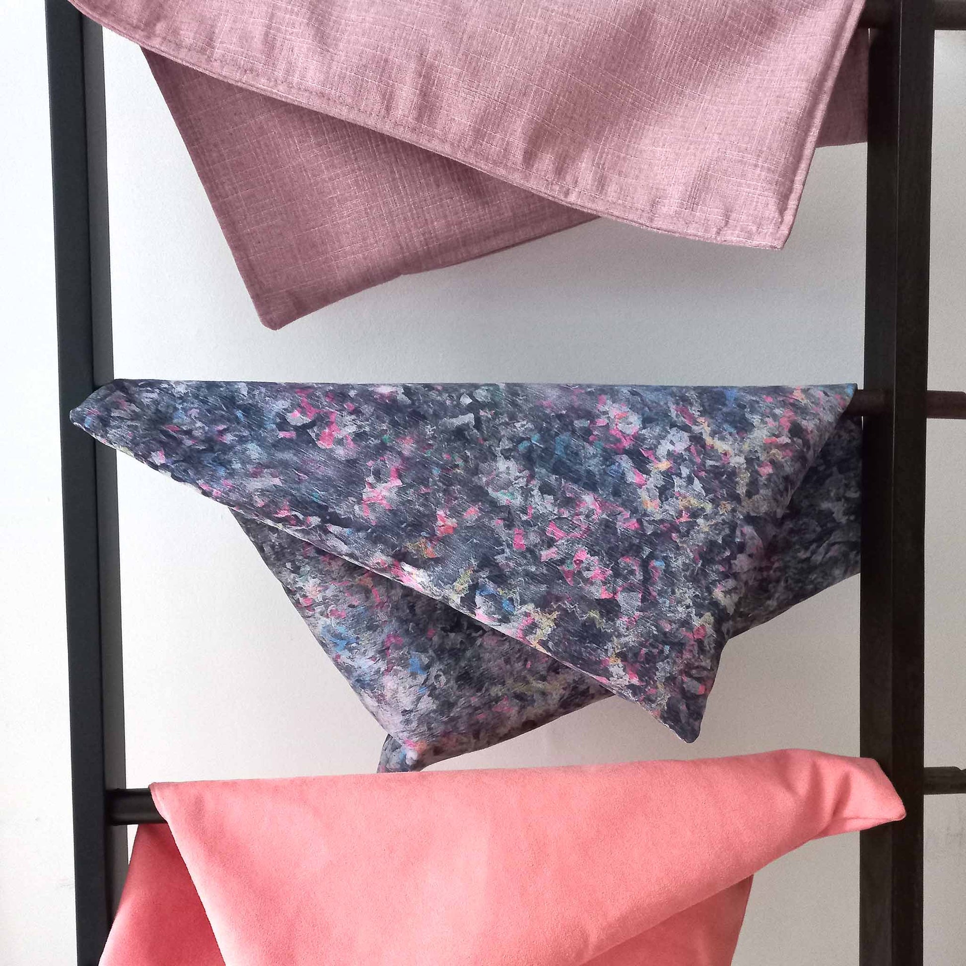 Decorative cushion covers on a ladder hanger